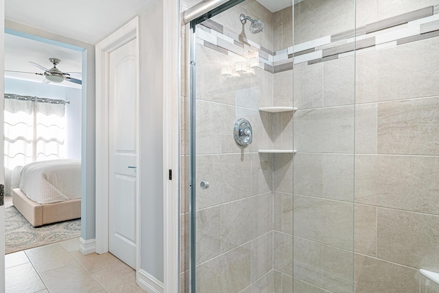 bathroom with tile patterned flooring, walk in shower, and ceiling fan