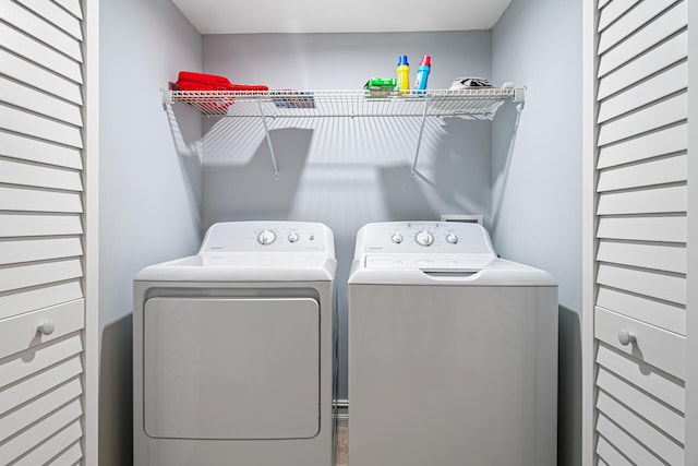 washroom featuring washing machine and dryer