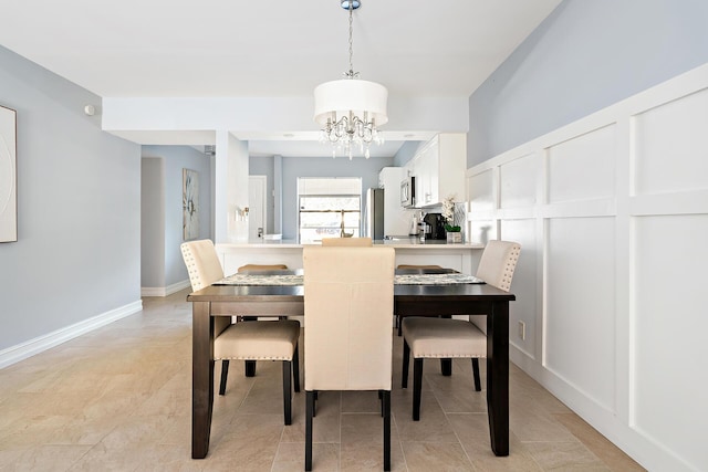 dining room with a chandelier