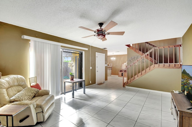 interior space featuring a textured ceiling and ceiling fan