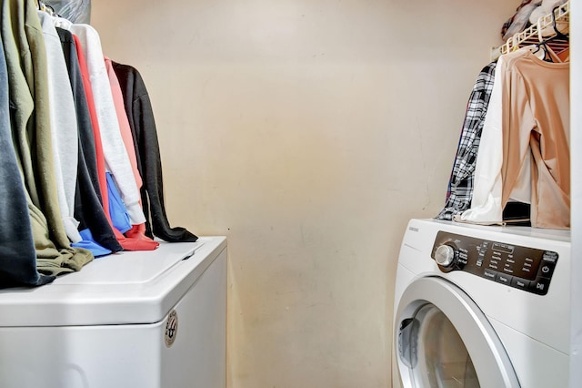 washroom featuring washer and dryer