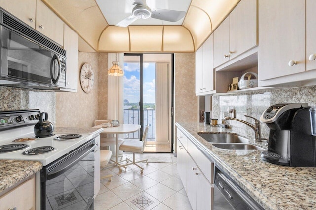 kitchen with ceiling fan, sink, white electric range, light stone counters, and light tile patterned flooring