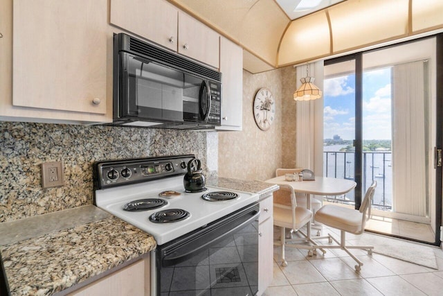 kitchen with a water view, light stone counters, white electric range, and light tile patterned floors