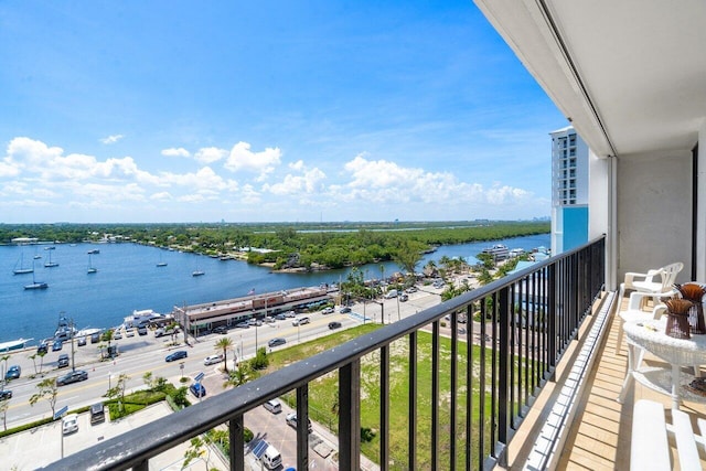 balcony featuring a water view