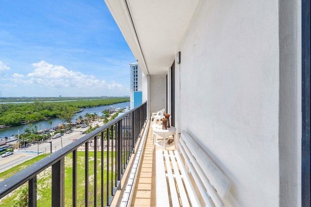 balcony featuring a water view