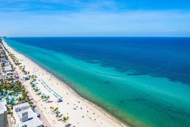 bird's eye view with a water view and a view of the beach