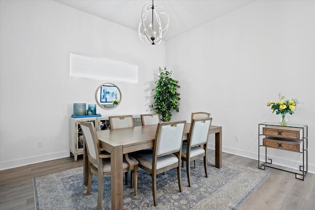 dining area featuring a notable chandelier and wood-type flooring