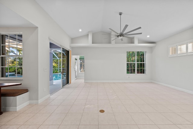 unfurnished room featuring light tile patterned floors, vaulted ceiling, and ceiling fan