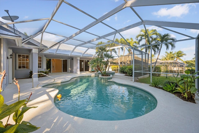 view of pool featuring a patio area and a lanai