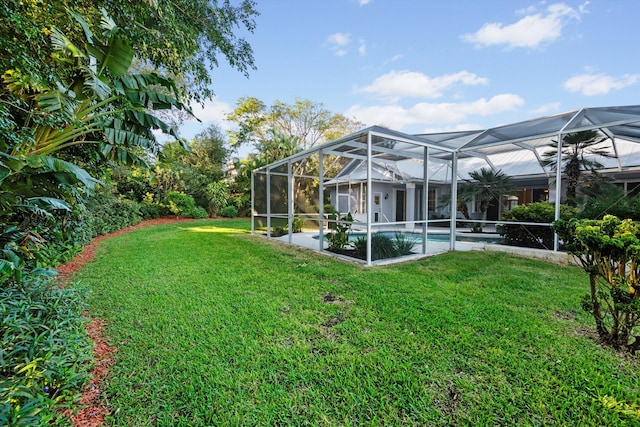 view of yard with glass enclosure