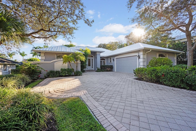 ranch-style home featuring a garage