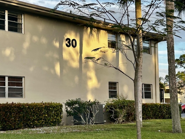 view of property exterior featuring central AC