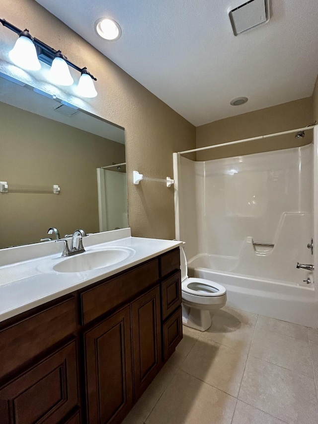 full bathroom featuring vanity, tile patterned flooring, toilet, a textured ceiling, and tub / shower combination