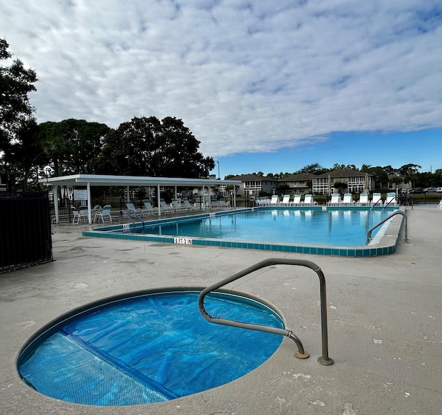 view of swimming pool featuring a patio