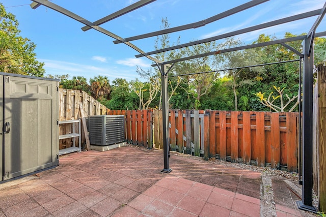 view of patio / terrace featuring central AC unit and a pergola