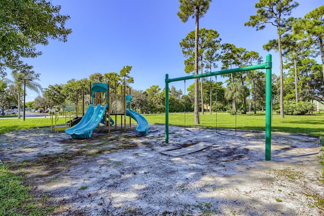 view of playground with a lawn