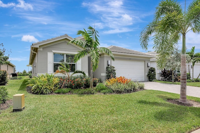 view of front facade with a front yard and a garage