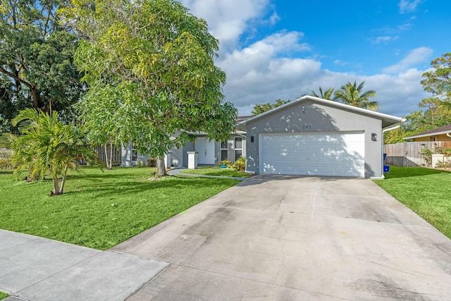 view of front of house with a garage and a front lawn