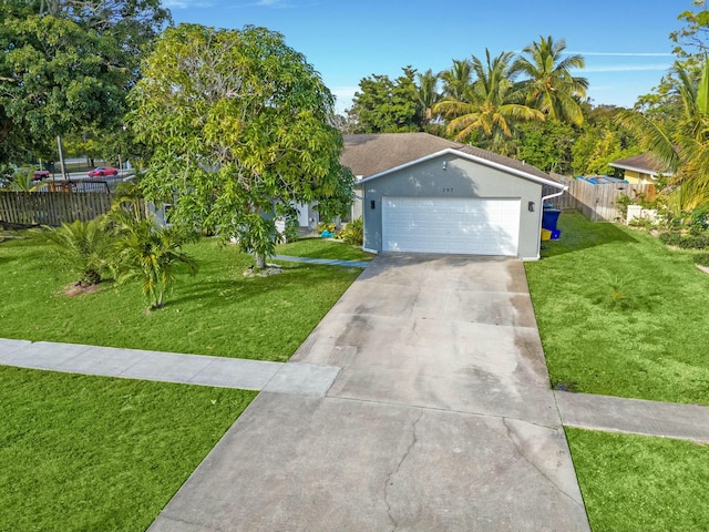 ranch-style home with a garage and a front yard