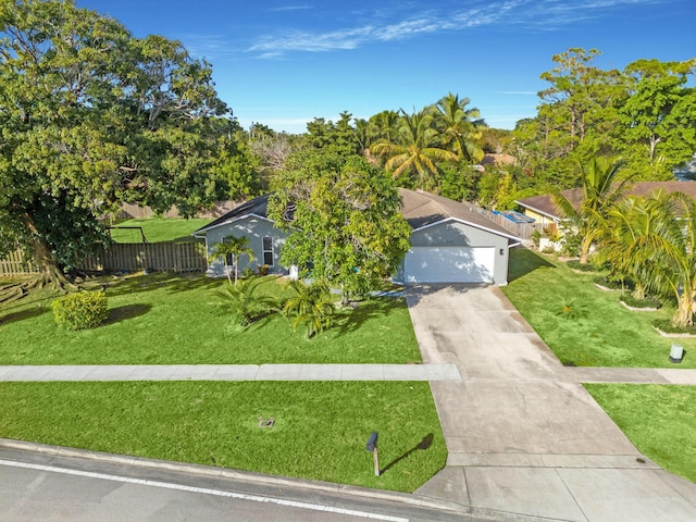 view of front facade featuring a garage and a front lawn