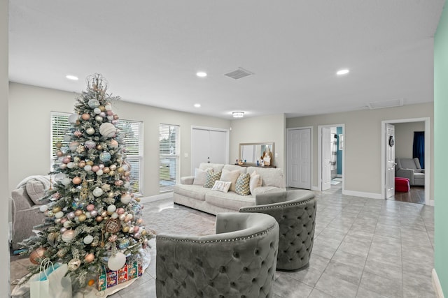 living room with light tile patterned floors