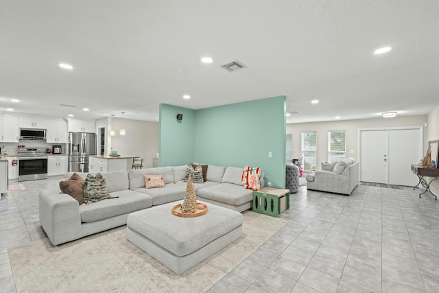 living room featuring light tile patterned floors