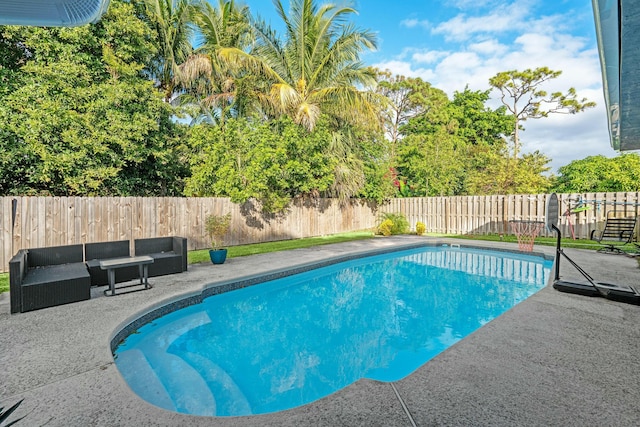 view of swimming pool featuring a patio area