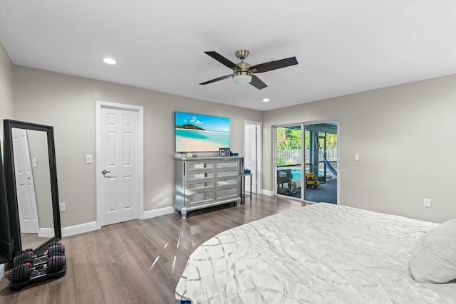 bedroom featuring hardwood / wood-style floors, ceiling fan, and access to exterior