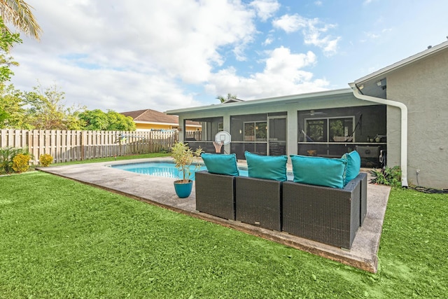 view of pool featuring a sunroom, a patio area, and a yard