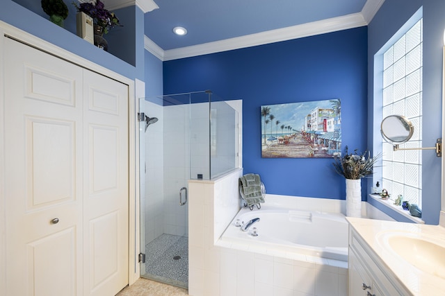 bathroom with ornamental molding, a healthy amount of sunlight, and vanity