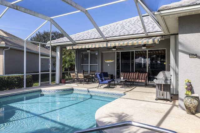 view of pool with area for grilling, outdoor lounge area, a patio, and ceiling fan