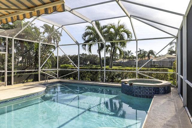 view of pool featuring an in ground hot tub, a patio, and glass enclosure