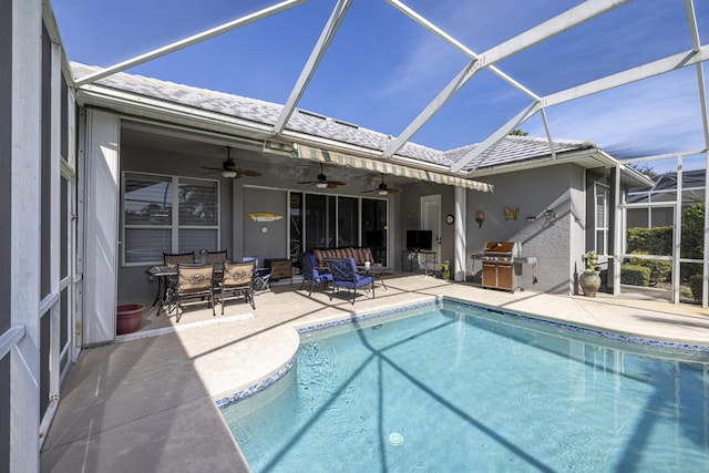 view of swimming pool featuring ceiling fan, area for grilling, and a patio area