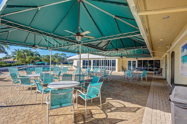 view of patio featuring ceiling fan