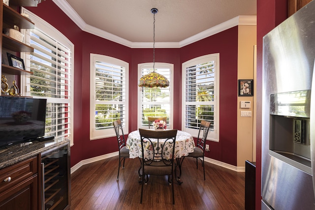 dining room with wine cooler, a healthy amount of sunlight, and crown molding