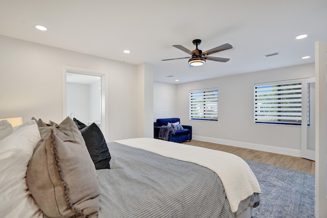 bedroom featuring wood-type flooring and ceiling fan