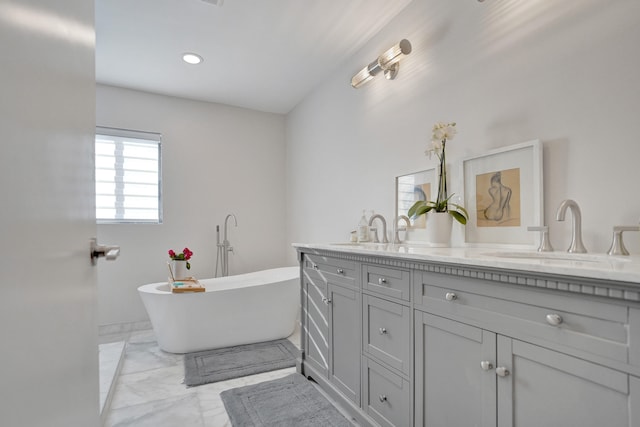 bathroom featuring a bathing tub and vanity