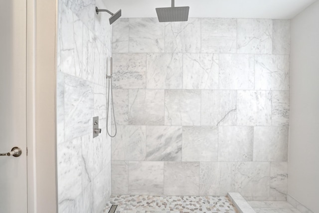 bathroom with tiled shower