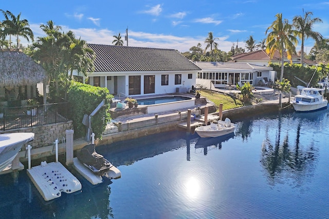 view of dock featuring a patio and a water view