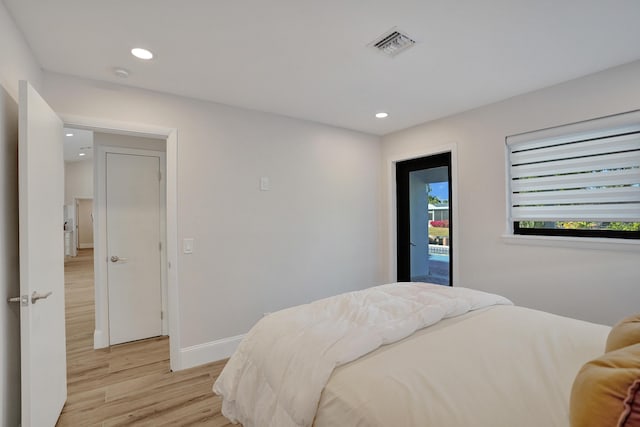 bedroom with light hardwood / wood-style floors