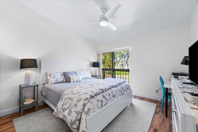 bedroom featuring ceiling fan, lofted ceiling, and dark wood-type flooring