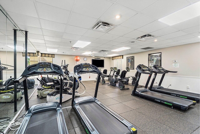 workout area with a paneled ceiling