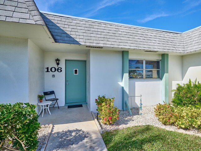 entrance to property with a patio area