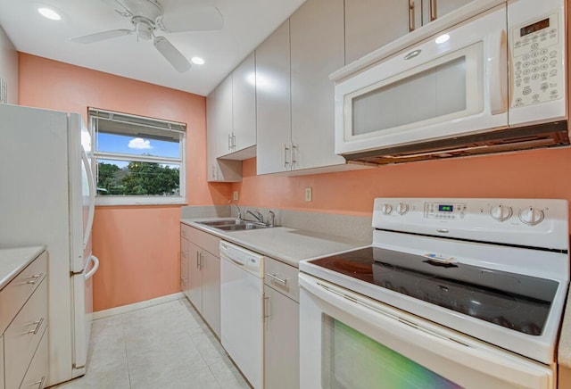 kitchen with white appliances, ceiling fan, sink, white cabinets, and light tile patterned flooring