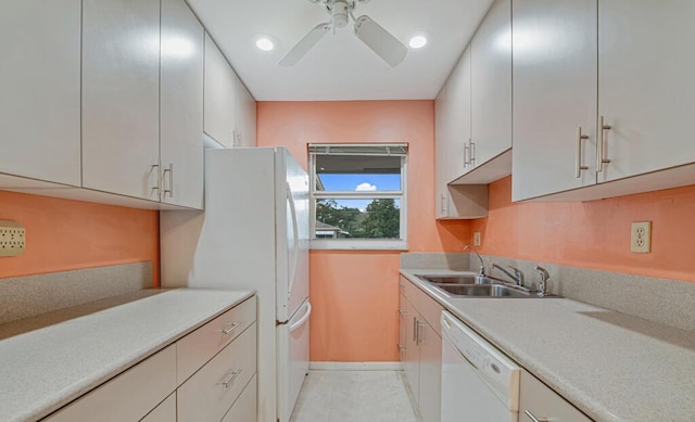 kitchen with ceiling fan, white appliances, sink, and light tile patterned floors