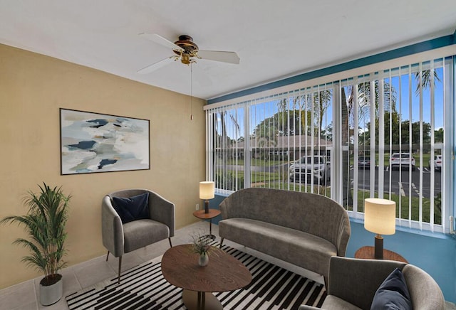 tiled living room with ceiling fan