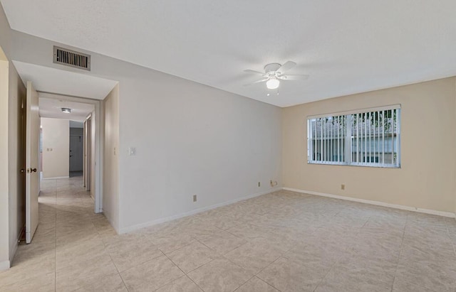 unfurnished room with ceiling fan