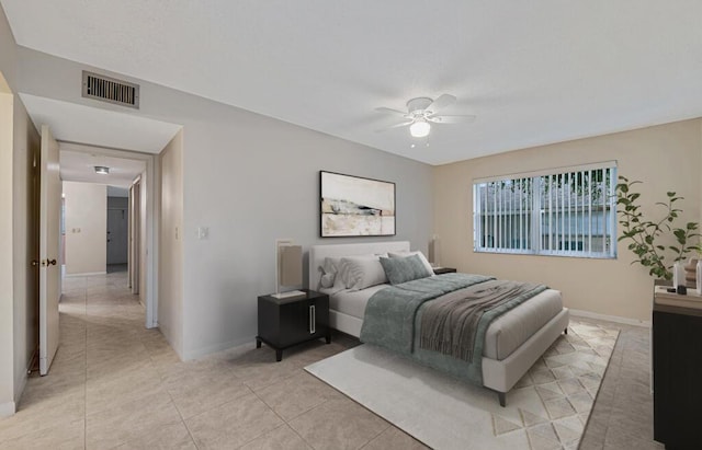 tiled bedroom featuring ceiling fan