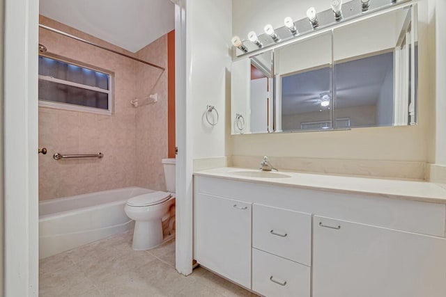 full bathroom featuring tile patterned floors, vanity, toilet, and tiled shower / bath