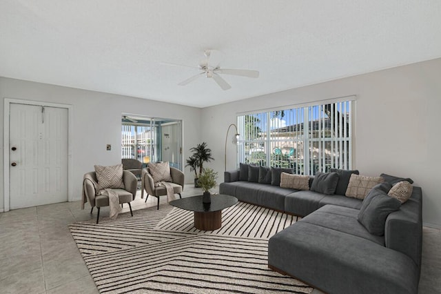 living room with light tile patterned floors and ceiling fan